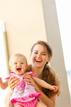 simsearch:400-06086432,k - Portrait of smiling mother and baby Stockbilder - Microstock & Abonnement, Bildnummer: 400-05908574