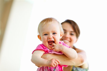 simsearch:400-06086432,k - Laughing baby playing with mother Stockbilder - Microstock & Abonnement, Bildnummer: 400-05908570