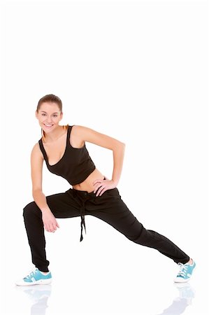 Beautiful fitness woman doing stretching exercise on white Stock Photo - Budget Royalty-Free & Subscription, Code: 400-05908711