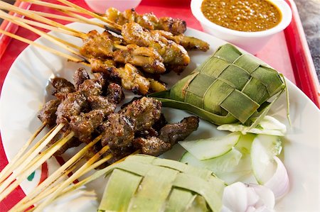 Chicken and Lamb Satay Skewers with Ketupat Rice and Peanut Sauce Stock Photo - Budget Royalty-Free & Subscription, Code: 400-05909014