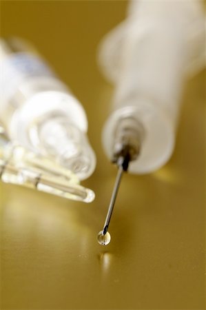 Close-up of vaccine drop on syringe needle Stockbilder - Microstock & Abonnement, Bildnummer: 400-05900149