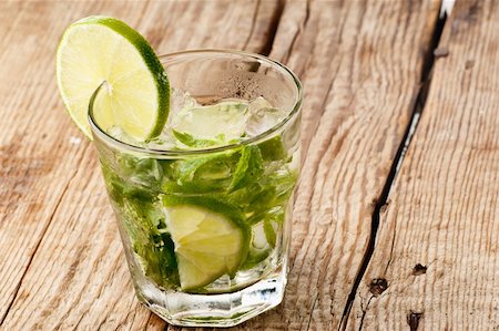 simsearch:400-07555096,k - Mojito with a slice of lime on a wooden table Stock Photo - Budget Royalty-Free & Subscription, Code: 400-05900166