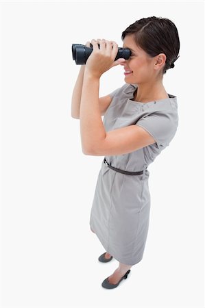 simsearch:400-04554899,k - Side view of woman using spyglasses against a white background Stock Photo - Budget Royalty-Free & Subscription, Code: 400-05900205
