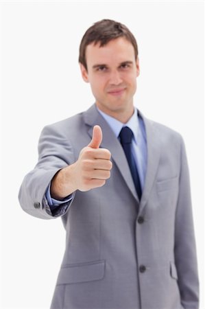 simsearch:400-05898224,k - Thumb up given by businessman against a white background Foto de stock - Royalty-Free Super Valor e Assinatura, Número: 400-05900227