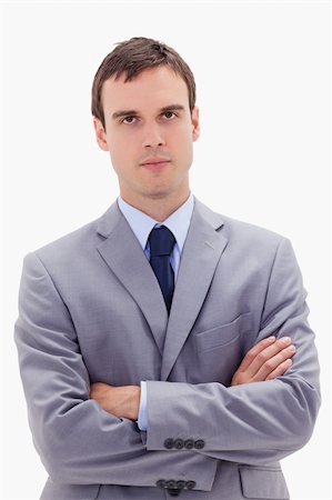 simsearch:400-05118165,k - Businessman standing with arms folded against a white background Foto de stock - Royalty-Free Super Valor e Assinatura, Número: 400-05900222