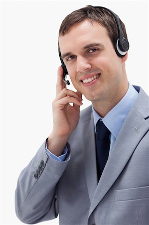 simsearch:400-06108986,k - Businessman using headset against a white background Stock Photo - Budget Royalty-Free & Subscription, Code: 400-05900248
