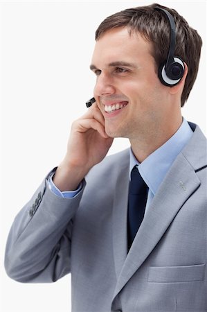 simsearch:400-06108986,k - Side view of businessman using headset against a white background Stock Photo - Budget Royalty-Free & Subscription, Code: 400-05900249