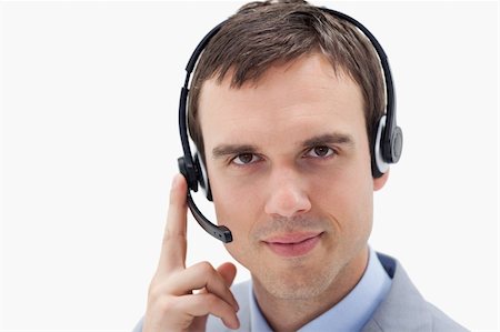 simsearch:400-06108986,k - Businessman with headset against a white background Stock Photo - Budget Royalty-Free & Subscription, Code: 400-05900250