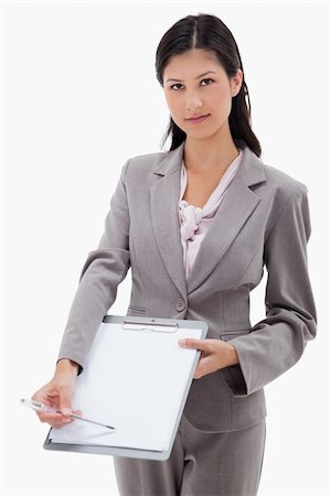simsearch:400-06633122,k - Businesswoman asking for signature against a white background Stock Photo - Budget Royalty-Free & Subscription, Code: 400-05900411
