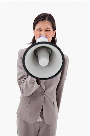 simsearch:400-06763387,k - Angry businesswoman yelling through megaphone against a white background Stock Photo - Budget Royalty-Free & Subscription, Code: 400-05900442