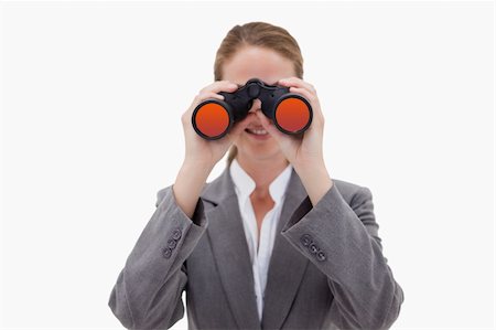 simsearch:400-04554899,k - Bank employee using spy glasses against a white background Stock Photo - Budget Royalty-Free & Subscription, Code: 400-05900490