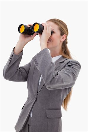 simsearch:400-04632747,k - Side view of bank employee with spyglasses against a white background Fotografie stock - Microstock e Abbonamento, Codice: 400-05900492