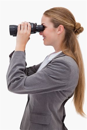 simsearch:400-04554899,k - Side view of smiling bank employee with spyglasses against a white background Stock Photo - Budget Royalty-Free & Subscription, Code: 400-05900493