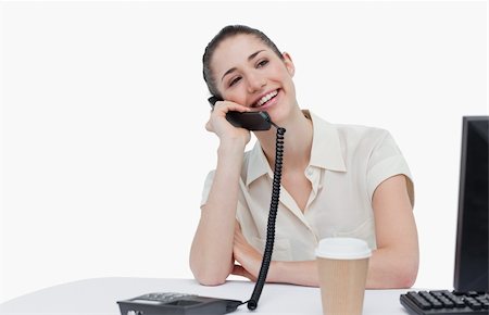 Laughing secretary answering the phone against a white background Stock Photo - Budget Royalty-Free & Subscription, Code: 400-05900625