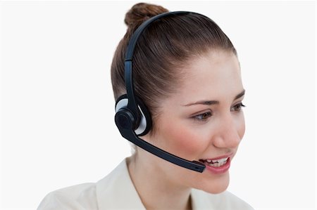 simsearch:400-04004131,k - Close up of an operator talking through a headset against a white background Foto de stock - Super Valor sin royalties y Suscripción, Código: 400-05900652