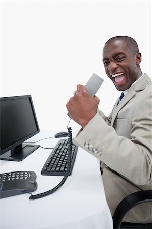 simsearch:400-05900712,k - Portrait of a successful businessman using a computer against a white background Stock Photo - Budget Royalty-Free & Subscription, Code: 400-05900681