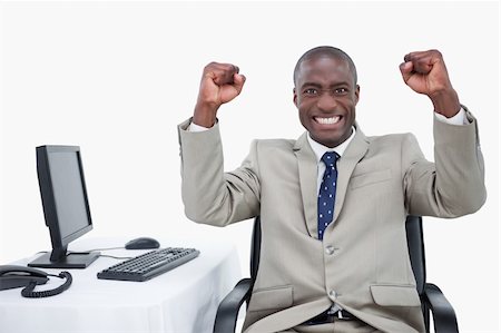 simsearch:400-05900712,k - Successful salesman with the fists up against a white background Stock Photo - Budget Royalty-Free & Subscription, Code: 400-05900699