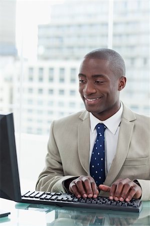 simsearch:400-08649785,k - Portrait of an office worker using a computer in his office Stock Photo - Budget Royalty-Free & Subscription, Code: 400-05900704