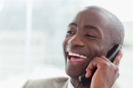 simsearch:400-05900712,k - Close up of a laughing businessman on the phone in his office Stock Photo - Budget Royalty-Free & Subscription, Code: 400-05900731