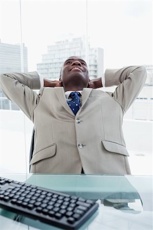 simsearch:400-05900688,k - Portrait of a businessman relaxing in his office Foto de stock - Super Valor sin royalties y Suscripción, Código: 400-05900758