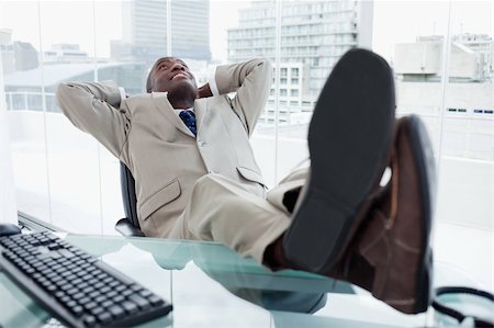 simsearch:400-04188055,k - Happy businessman relaxing in his office Stock Photo - Budget Royalty-Free & Subscription, Code: 400-05900759