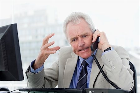 simsearch:400-08649785,k - Angry senior manager on the phone in his office Stock Photo - Budget Royalty-Free & Subscription, Code: 400-05900809