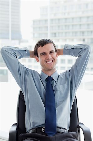 simsearch:400-04188055,k - Portrait of a happy manager relaxing in his office Stock Photo - Budget Royalty-Free & Subscription, Code: 400-05900869