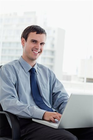 simsearch:400-07514126,k - Portrait of a manager using a notebook in his office Fotografie stock - Microstock e Abbonamento, Codice: 400-05900863