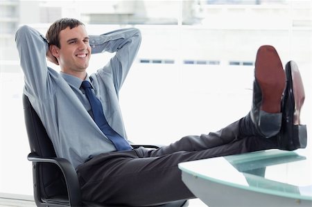 simsearch:400-05900668,k - Delighted manager relaxing in his office Stock Photo - Budget Royalty-Free & Subscription, Code: 400-05900872