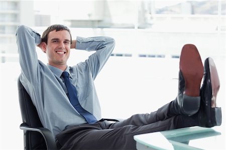 simsearch:400-05900668,k - Blissful manager relaxing in his office Stock Photo - Budget Royalty-Free & Subscription, Code: 400-05900873