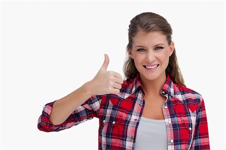 simsearch:400-06769983,k - Woman with the thumb up against a white background Foto de stock - Royalty-Free Super Valor e Assinatura, Número: 400-05900942