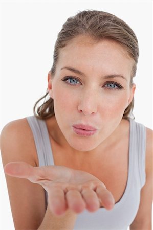 simsearch:400-04834980,k - Portrait of a beautiful woman blowing a kiss against a white background Stock Photo - Budget Royalty-Free & Subscription, Code: 400-05901041