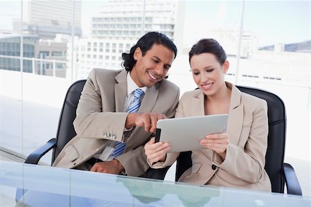 sales person with a tablet - Happy business team using a tablet computer in an office Stock Photo - Budget Royalty-Free & Subscription, Code: 400-05901068
