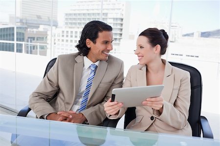 sales person with a tablet - Young business team using a tablet computer against a white background Stock Photo - Budget Royalty-Free & Subscription, Code: 400-05901069