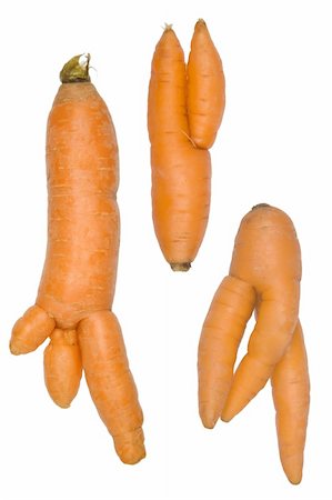 Unusual growth of carrots isolated on white Stock Photo - Budget Royalty-Free & Subscription, Code: 400-05901414