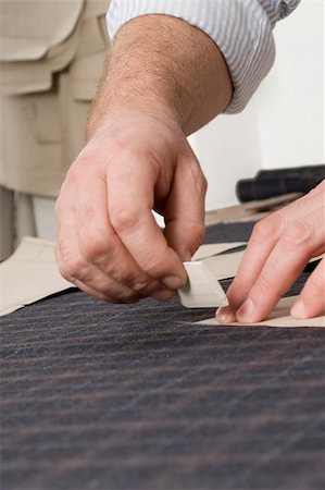 Tailor at work, drawing line on fabric with chalk Stock Photo - Budget Royalty-Free & Subscription, Code: 400-05901446