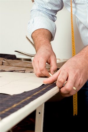 Tailor at work, drawing line on fabric with chalk Stock Photo - Budget Royalty-Free & Subscription, Code: 400-05901447