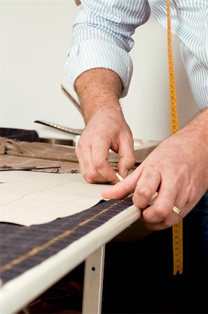 sewing factory - Tailor at work, drawing line on fabric with chalk Photographie de stock - Aubaine LD & Abonnement, Code: 400-05901447