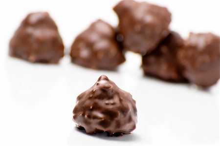 Delicious chocolates and nuts on white background Foto de stock - Super Valor sin royalties y Suscripción, Código: 400-05901884