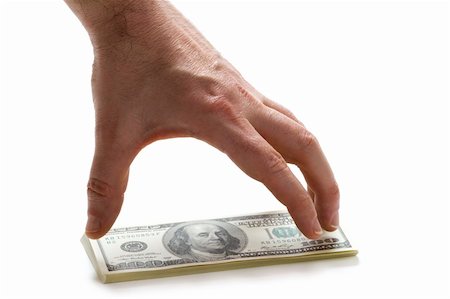 a male hand reaching for a wad of american 100 (hundred) dollar bills Stock Photo - Budget Royalty-Free & Subscription, Code: 400-05902012