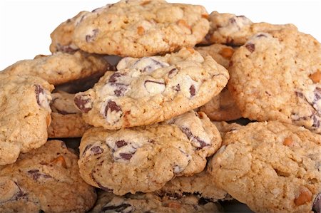 simsearch:400-04093610,k - Mound of home-made chocolate and butterscotch chip cookies against a white background Stock Photo - Budget Royalty-Free & Subscription, Code: 400-05902446