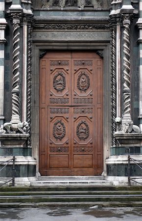 Fragment of old building and nice wooden door with fillet Stock Photo - Budget Royalty-Free & Subscription, Code: 400-05902466