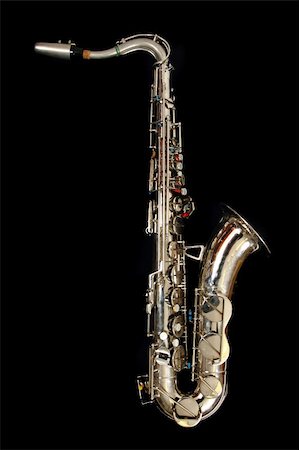 old saxophone isolated on the black background Foto de stock - Super Valor sin royalties y Suscripción, Código: 400-05902540