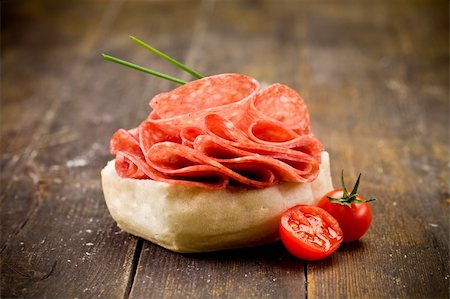 photo of delicious salami sandwich on wooden table Stockbilder - Microstock & Abonnement, Bildnummer: 400-05902783