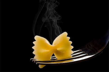 smoking hot italian pasta holded by silver fork on black background Stockbilder - Microstock & Abonnement, Bildnummer: 400-05902810