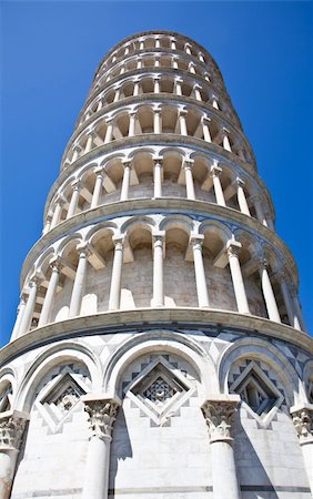 roman towers - Italy - Pisa. The famous leaning tower on a perfect blue bakcground Stock Photo - Budget Royalty-Free & Subscription, Code: 400-05902884