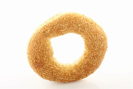 Close up of sesame bagel over white Stock Photo - Budget Royalty-Free & Subscription, Code: 400-05902973