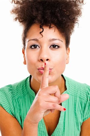 simsearch:400-06364563,k - Beautiful young woman hushing with finger on lips. Studio shot with isolated white background. Stock Photo - Budget Royalty-Free & Subscription, Code: 400-05903040