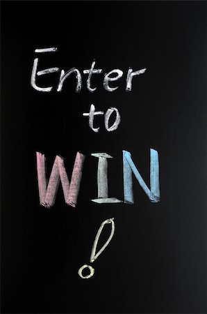 Enter to win with a big question mark written in chalk on blackboard Stock Photo - Budget Royalty-Free & Subscription, Code: 400-05903230