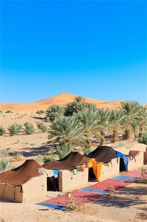 A bedouin camp against one of the huge orange sand dunes in Erg Chebbi, Morocco Stock Photo - Budget Royalty-Free & Subscription, Code: 400-05903636